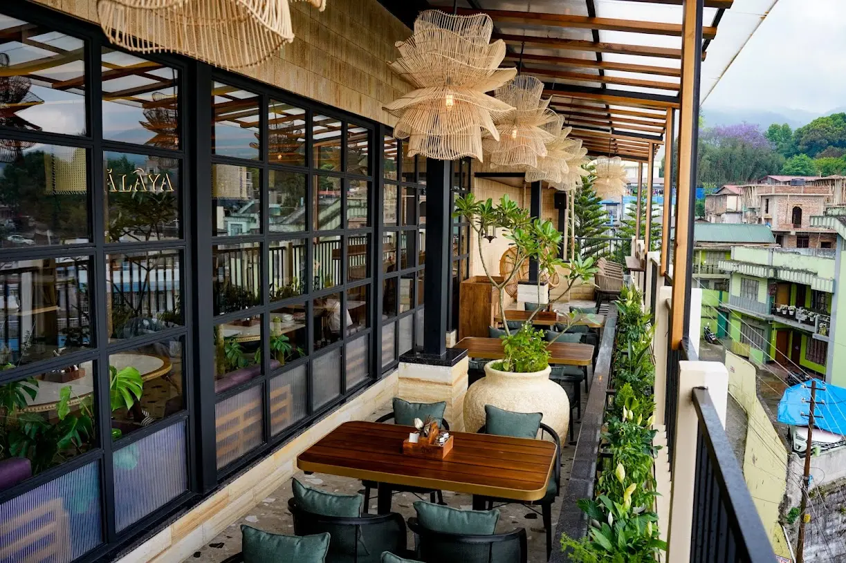 Daytime rooftop terrace at Ālaya overlooking Shillong